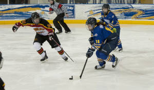 Rams forward Erin Brazeau carries the puck into the Guelph zone. Photo courtesy of Stephen Kassim.